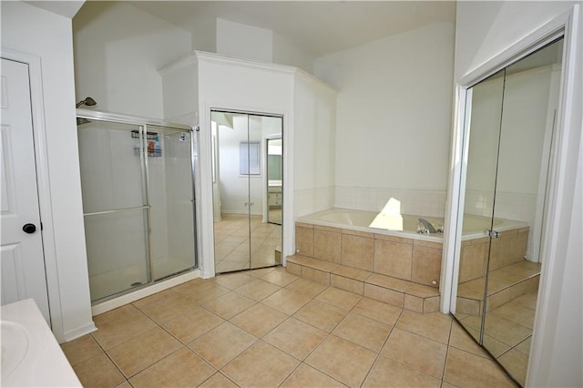 17586 W 112th St, Olathe, KS 66061 - full bathroom featuring tile patterned floors, a bath, a shower stall, and vanity