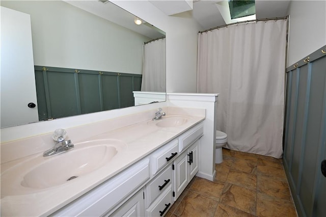 17586 W 112th St, Olathe, KS 66061 - bathroom featuring stone finish floors, double vanity, toilet, and a shower with curtain