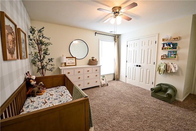 17586 W 112th St, Olathe, KS 66061 - carpeted bedroom featuring a closet, wallpapered walls, and ceiling fan