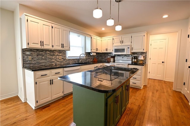 17586 W 112th St, Olathe, KS 66061 - kitchen featuring white appliances, a sink, white cabinetry, decorative backsplash, and decorative light fixtures
