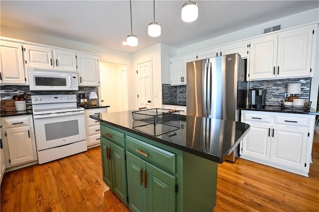 17586 W 112th St, Olathe, KS 66061 - kitchen with white appliances, green cabinets, white cabinetry, and backsplash