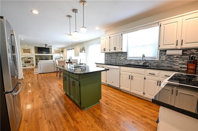 17586 W 112th St, Olathe, KS 66061 - kitchen featuring freestanding refrigerator, white dishwasher, dark countertops, a sink, and recessed lighting