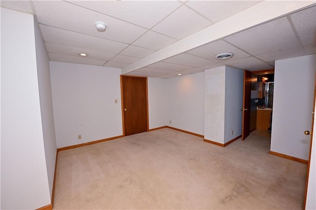 17586 W 112th St, Olathe, KS 66061 - finished below grade area featuring light colored carpet, baseboards, and a paneled ceiling