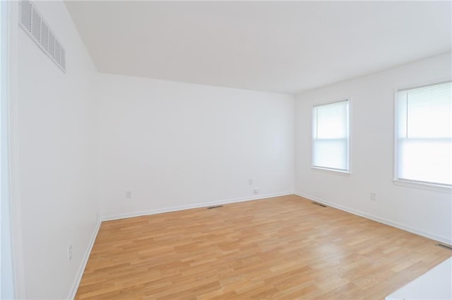 956 Ridge Dr, Warrensburg, MO 64093 - unfurnished room with light wood finished floors and baseboards
