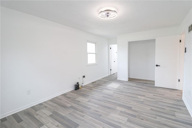 956 Ridge Dr, Warrensburg, MO 64093 - spare room with light wood-type flooring and baseboards
