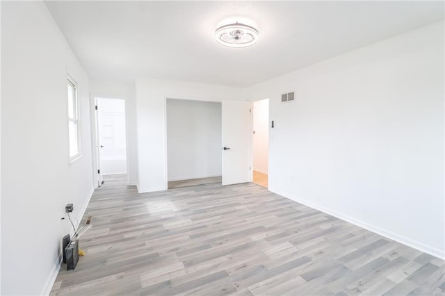 956 Ridge Dr, Warrensburg, MO 64093 - empty room featuring light wood-style flooring and baseboards
