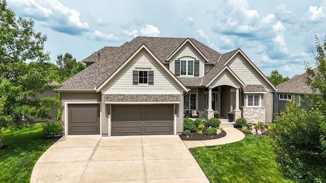 16005 Melrose St, Overland Park, KS 66221 - craftsman inspired home featuring concrete driveway, a front lawn, stone siding, and a shingled roof