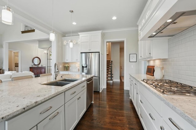 16005 Melrose St, Overland Park, KS 66221 - kitchen featuring appliances with stainless steel finishes, custom exhaust hood, backsplash, white cabinets, and recessed lighting
