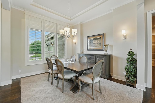 16005 Melrose St, Overland Park, KS 66221 - dining space with healthy amount of natural light, crown molding, dark wood finished floors, and a chandelier