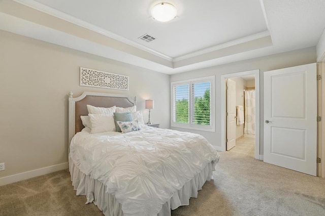 16005 Melrose St, Overland Park, KS 66221 - bedroom featuring light colored carpet, ornamental molding, a raised ceiling, and ensuite bath