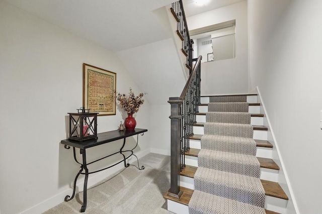16005 Melrose St, Overland Park, KS 66221 - staircase featuring carpet floors and lofted ceiling