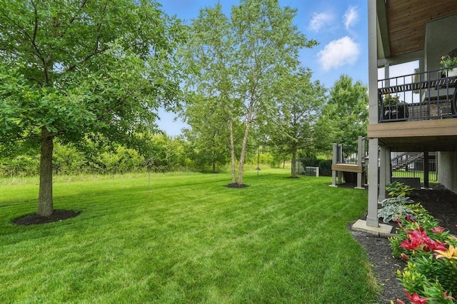 16005 Melrose St, Overland Park, KS 66221 - view of grassy yard with stairway and view of wooded area