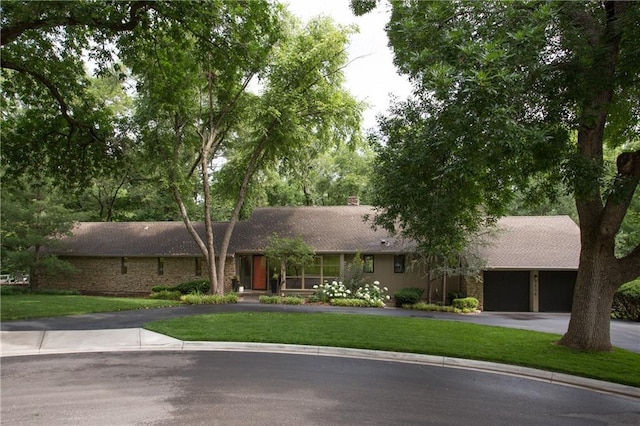 9804 Ensley Ln, Leawood, KS 66206 - ranch-style house with asphalt driveway, a front lawn, a garage, and a chimney