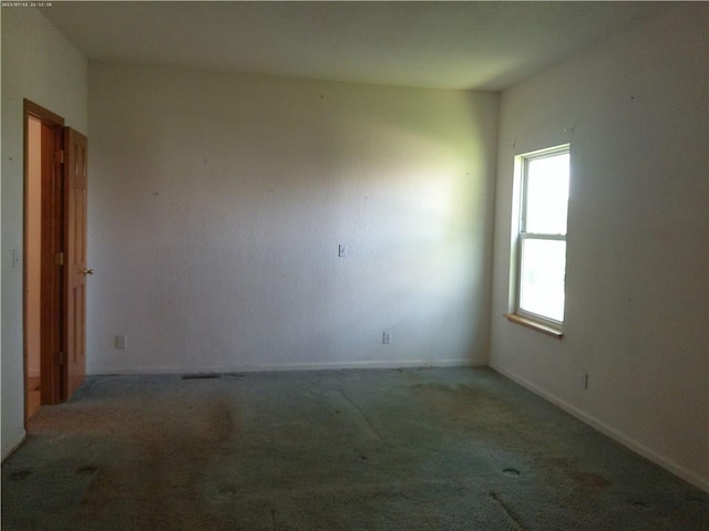 503 W Shawnee St, Paola, KS 66071 - empty room with carpet floors and baseboards