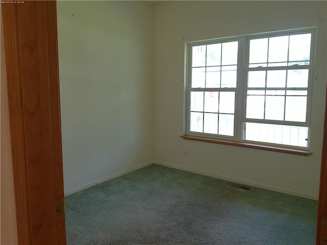 503 W Shawnee St, Paola, KS 66071 - carpeted empty room featuring baseboards