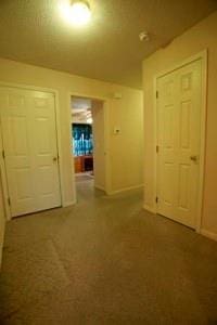 814 Clancy Ct, Raymore, MO 64083 - hall featuring carpet