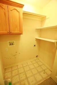 814 Clancy Ct, Raymore, MO 64083 - laundry room with electric dryer hookup, washer hookup, cabinet space, and baseboards