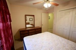 814 Clancy Ct, Raymore, MO 64083 - bedroom featuring a closet and a ceiling fan