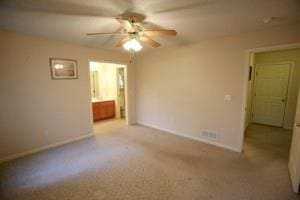 814 Clancy Ct, Raymore, MO 64083 - spare room with ceiling fan, baseboards, and carpet