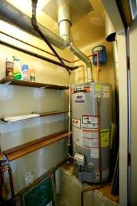 814 Clancy Ct, Raymore, MO 64083 - utility room featuring water heater