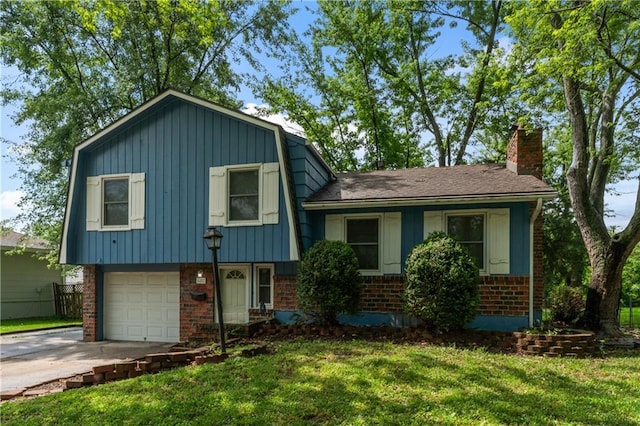 6401 E 120th Ter, Grandview, MO 64030 - tri-level home featuring brick siding, a front lawn, a chimney, and driveway