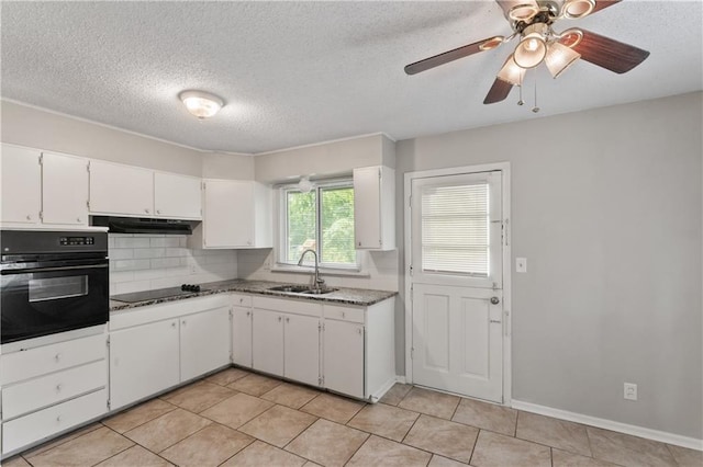 6401 E 120th Ter, Grandview, MO 64030 - kitchen featuring black appliances, a sink, decorative backsplash, white cabinets, and light tile patterned floors
