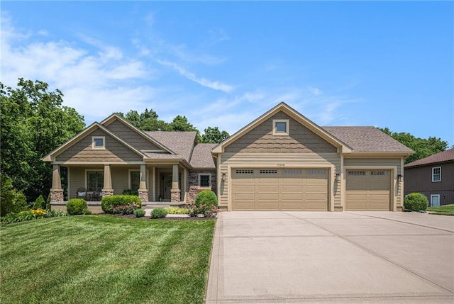 11408 NE 113th Ter, Liberty, MO 64068 - craftsman house with an attached garage, driveway, a front lawn, and covered porch
