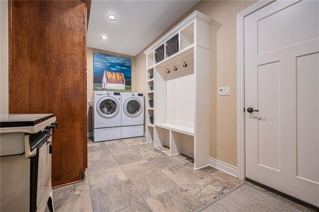 11408 NE 113th Ter, Liberty, MO 64068 - laundry area featuring washing machine and clothes dryer, light stone finish flooring, and recessed lighting