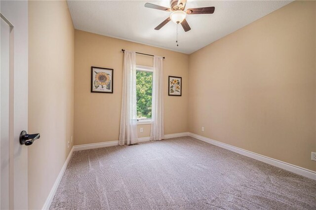 11408 NE 113th Ter, Liberty, MO 64068 - spare room featuring carpet floors and ceiling fan