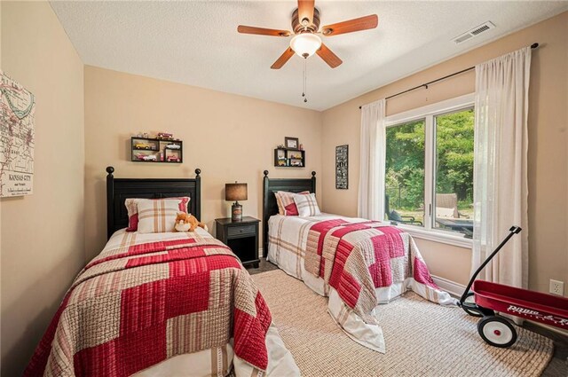 11408 NE 113th Ter, Liberty, MO 64068 - carpeted bedroom featuring a ceiling fan