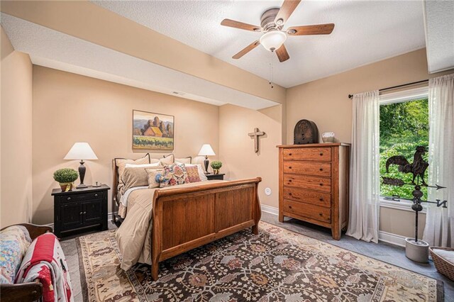 11408 NE 113th Ter, Liberty, MO 64068 - carpeted bedroom with a textured ceiling and ceiling fan