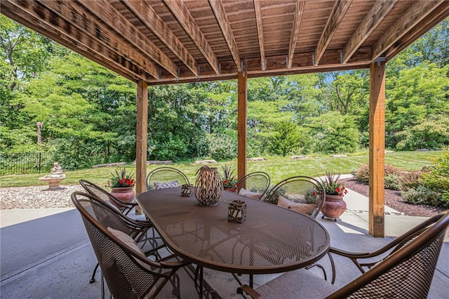 11408 NE 113th Ter, Liberty, MO 64068 - view of patio featuring outdoor dining area and view of wooded area