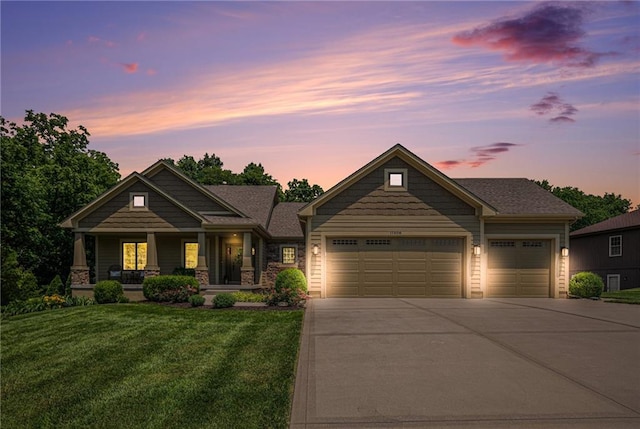 11408 NE 113th Ter, Liberty, MO 64068 - view of front facade with an attached garage, driveway, a front yard, and covered porch