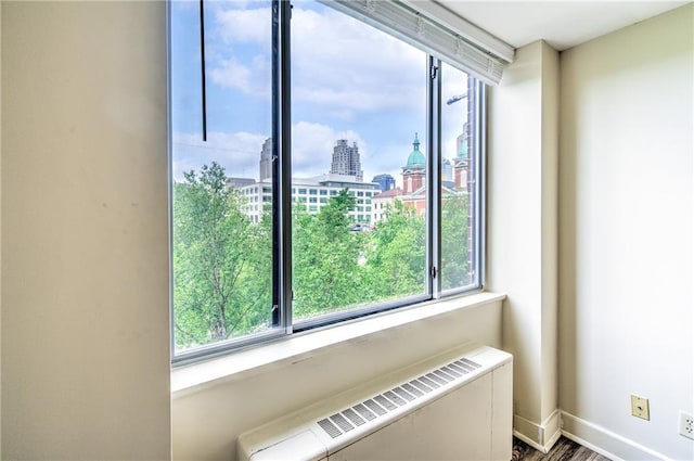 600 E 8th St Unit 5N, Kansas City, MO 64106 - detailed view of radiator heating unit, a city view, and baseboards