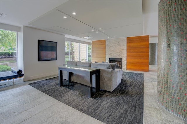 600 E 8th St Unit 5N, Kansas City, MO 64106 - living room with recessed lighting, a stone fireplace, and baseboards