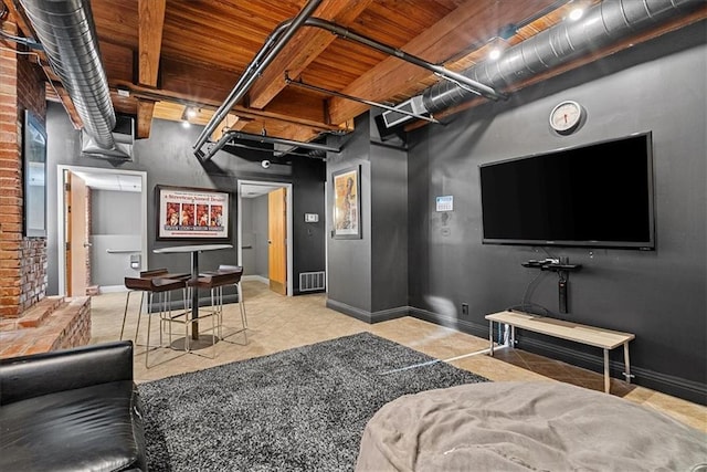 700 Broadway Blvd Unit 507, Kansas City, MO 64105 - tiled living room with baseboards and wooden ceiling