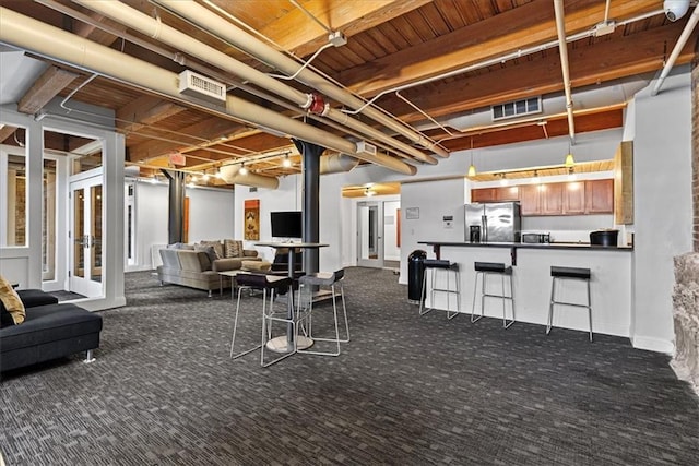700 Broadway Blvd Unit 507, Kansas City, MO 64105 - below grade area with stainless steel fridge with ice dispenser and dark colored carpet