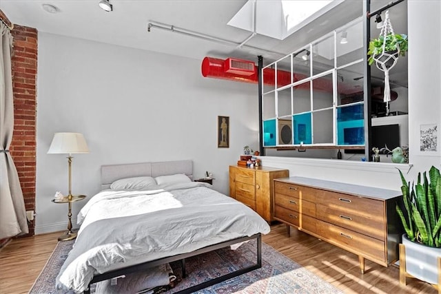 700 Broadway Blvd Unit 507, Kansas City, MO 64105 - bedroom with a skylight and wood finished floors