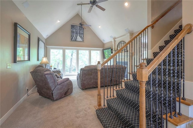 309 E 126th St, Kansas City, MO 64145 - carpeted living room featuring high vaulted ceiling, a ceiling fan, stairway, and recessed lighting