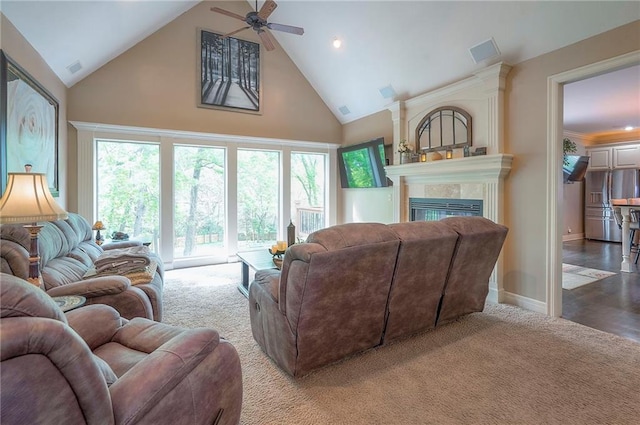 309 E 126th St, Kansas City, MO 64145 - living room featuring high vaulted ceiling, ceiling fan, carpet flooring, and a tiled fireplace