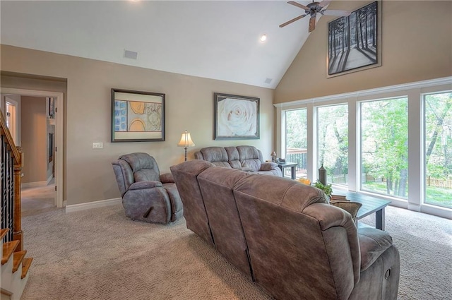 309 E 126th St, Kansas City, MO 64145 - carpeted living area featuring high vaulted ceiling, a ceiling fan, stairway, and recessed lighting