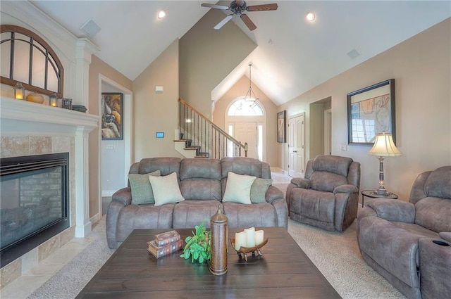 309 E 126th St, Kansas City, MO 64145 - living room featuring a ceiling fan, stairs, high vaulted ceiling, and a fireplace