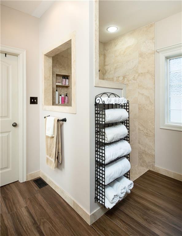 309 E 126th St, Kansas City, MO 64145 - bathroom with wood finished floors and baseboards