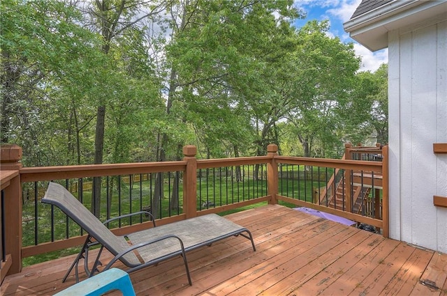 309 E 126th St, Kansas City, MO 64145 - wooden deck featuring view of wooded area