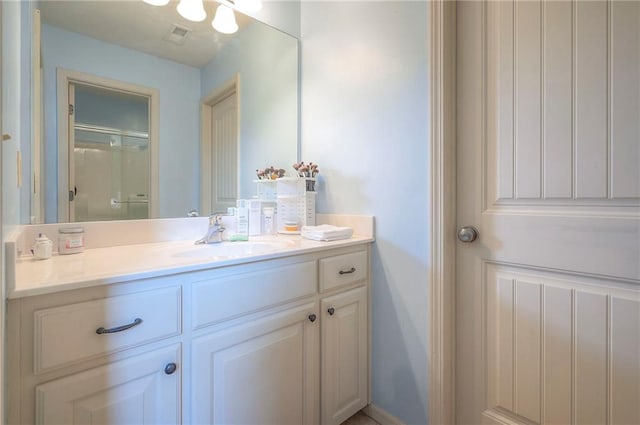 309 E 126th St, Kansas City, MO 64145 - bathroom featuring vanity and a shower with shower door