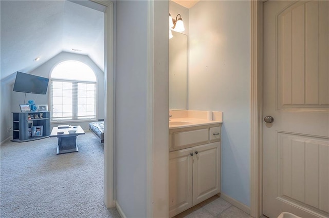 309 E 126th St, Kansas City, MO 64145 - bathroom with vaulted ceiling and vanity