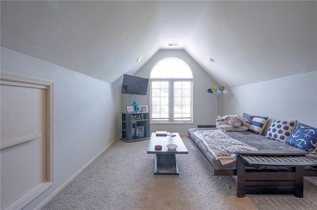 309 E 126th St, Kansas City, MO 64145 - carpeted living area featuring vaulted ceiling and baseboards