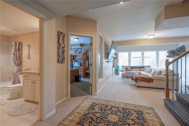 309 E 126th St, Kansas City, MO 64145 - hallway featuring light colored carpet and light tile patterned flooring