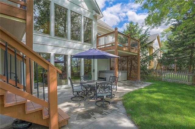 309 E 126th St, Kansas City, MO 64145 - view of patio / terrace with a hot tub, outdoor dining space, and stairway