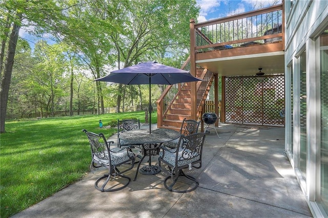 309 E 126th St, Kansas City, MO 64145 - fenced backyard with stairway, a patio area, and outdoor dining space